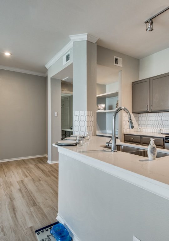 a kitchen with a stove, microwave and refrigerator at The  Montgomery