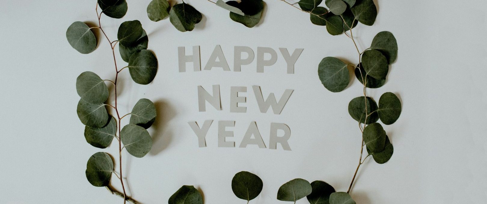 happy new year greeting card with eucalyptus leaves at The  Montgomery